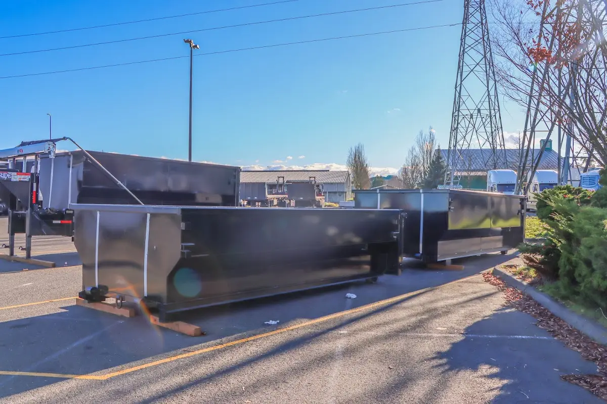 Roll-off dumpster ready for waste disposal at job site for 2 Yard Dumpster Rental in Essex